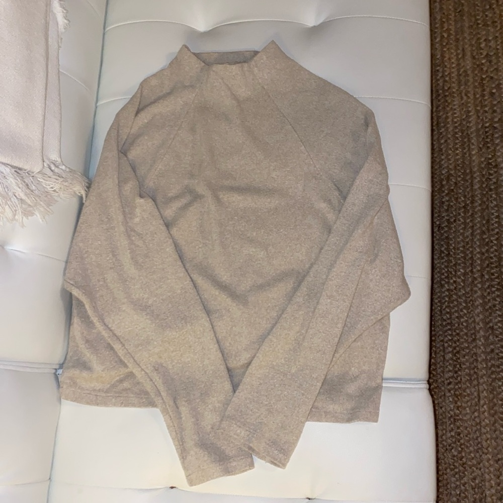 Tan turtleneck sweater